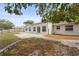 Backyard with a concrete patio for outdoor enjoyment and a brick pathway leading to the yard at 2232 River Ridge Dr, Sarasota, FL 34239