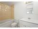 Well-lit bathroom features a tub and shower combination, white vanity, and bright light fixture at 2232 River Ridge Dr, Sarasota, FL 34239