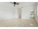Neutral bedroom with tile flooring, a ceiling fan, and an ensuite bathroom at 2232 River Ridge Dr, Sarasota, FL 34239