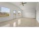 Light-filled bedroom with a door to the backyard and large windows for ample natural light at 2232 River Ridge Dr, Sarasota, FL 34239