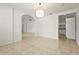 Open dining area with tile flooring, a modern light fixture, and views of the kitchen and living room at 2232 River Ridge Dr, Sarasota, FL 34239