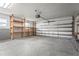 Spacious garage with ample storage shelves and well-lit interiors at 2232 River Ridge Dr, Sarasota, FL 34239