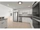 This kitchen offers stainless steel appliances, white cabinets, and an eat-in area at 2232 River Ridge Dr, Sarasota, FL 34239