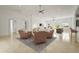 Open-concept living room features recessed lighting, neutral colors, ceiling fan, and tile flooring at 2232 River Ridge Dr, Sarasota, FL 34239