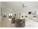 Spacious living room with neutral decor, ceiling fans, recessed lights, and a decorative area rug at 2232 River Ridge Dr, Sarasota, FL 34239