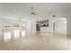 Spacious open-concept living room featuring tile flooring, lots of natural light, and modern ceiling fans at 2232 River Ridge Dr, Sarasota, FL 34239