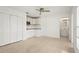 Inviting living space featuring a ceiling fan, an efficiency kitchen, and a bathroom at 2232 River Ridge Dr, Sarasota, FL 34239