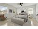 Serene main bedroom featuring a cozy bed, a decorative bench, and two windows that provide plenty of natural light at 2232 River Ridge Dr, Sarasota, FL 34239
