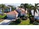 One-story house with grey walls and terracotta roof, surrounded by palm trees at 5116 Brooksbend Cir, Sarasota, FL 34238