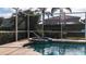 Refreshing screened pool and spa with a tranquil setting at 5116 Brooksbend Cir, Sarasota, FL 34238