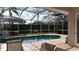 Inviting screened pool and spa with patio furniture, perfect for relaxation at 5116 Brooksbend Cir, Sarasota, FL 34238