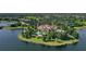 Island community with lake access, lush landscaping, and clubhouse at 16435 Daysailor Trl, Lakewood Ranch, FL 34202