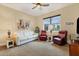 Relaxing sitting area featuring a white couch and red leather armchairs at 16435 Daysailor Trl, Lakewood Ranch, FL 34202