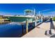 Boat on lift at waterfront property at 1200 Via Tripoli, Punta Gorda, FL 33950