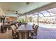 Outdoor patio with seating, dining area, and pool view at 1200 Via Tripoli, Punta Gorda, FL 33950