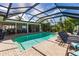 Large, refreshing pool with screened enclosure and patio furniture at 1200 Via Tripoli, Punta Gorda, FL 33950