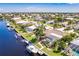 Aerial view of waterfront home with pool and boat at 1200 Via Tripoli, Punta Gorda, FL 33950