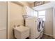 Laundry room with washer, dryer, and utility sink at 1200 Via Tripoli, Punta Gorda, FL 33950