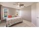 King-size bed, window, and ceiling fan in this bedroom at 1200 Via Tripoli, Punta Gorda, FL 33950