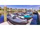 Two jet skis on a dock at waterfront property at 1200 Via Tripoli, Punta Gorda, FL 33950