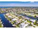 Wide aerial view of waterfront home and community at 1200 Via Tripoli, Punta Gorda, FL 33950