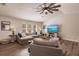 Spacious living room featuring a large sectional sofa and wood-look floors at 1200 Via Tripoli, Punta Gorda, FL 33950