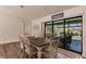 Charming dining area with table and chairs, overlooking the pool at 1200 Via Tripoli, Punta Gorda, FL 33950