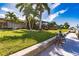 Landscaped backyard with canal access and lush greenery at 1200 Via Tripoli, Punta Gorda, FL 33950