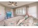 Comfortable bedroom with a TV and large windows at 1200 Via Tripoli, Punta Gorda, FL 33950