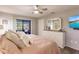 Main bedroom with king-size bed and access to the backyard patio at 1200 Via Tripoli, Punta Gorda, FL 33950