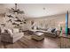 Open living area showcasing a sectional sofa and coastal decor at 1200 Via Tripoli, Punta Gorda, FL 33950