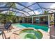 Stunning pool and spa with screened enclosure and outdoor kitchen at 1200 Via Tripoli, Punta Gorda, FL 33950