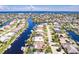 Wide aerial view of waterfront home and community at 1200 Via Tripoli, Punta Gorda, FL 33950