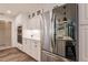 Sleek kitchen with stainless steel refrigerator and white cabinetry at 1200 Via Tripoli, Punta Gorda, FL 33950