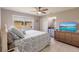 Guest bedroom with a queen-size bed and mounted TV at 1200 Via Tripoli, Punta Gorda, FL 33950