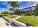 Landscaped backyard with pool enclosure and lush greenery at 1200 Via Tripoli, Punta Gorda, FL 33950