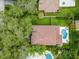 Aerial view of home with a red tile roof and a swimming pool at 4013 Red Rock Ln, Sarasota, FL 34231