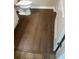 Dark brown laminate flooring in a bathroom at 4102 Central Sarasota Pkwy # 922, Sarasota, FL 34238