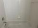 Clean bathroom with white tile and a bathtub at 4102 Central Sarasota Pkwy # 922, Sarasota, FL 34238