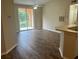 Condo living room with new flooring and access to balcony at 4102 Central Sarasota Pkwy # 922, Sarasota, FL 34238