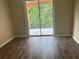 Bedroom with sliding glass door to balcony and laminate flooring at 4102 Central Sarasota Pkwy # 922, Sarasota, FL 34238