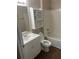 Bathroom with white vanity, toilet, bathtub and laminate flooring at 4102 Central Sarasota Pkwy # 922, Sarasota, FL 34238