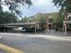 Condo building with covered parking and landscaping at 4102 Central Sarasota Pkwy # 922, Sarasota, FL 34238
