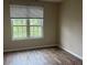 Bright bedroom with large window and laminate flooring at 4102 Central Sarasota Pkwy # 922, Sarasota, FL 34238