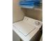 Laundry closet with shelving and a white top load washer at 4102 Central Sarasota Pkwy # 922, Sarasota, FL 34238