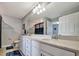 Double vanity bathroom with quartz countertops and modern fixtures at 17724 Gawthrop Dr # 201, Bradenton, FL 34211