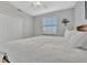 Bright bedroom with a king-size bed and large window at 17724 Gawthrop Dr # 201, Bradenton, FL 34211