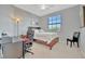 Bedroom with a king-size bed, desk, and chair, offering versatility at 17724 Gawthrop Dr # 201, Bradenton, FL 34211