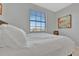 Bright bedroom with large window and comfortable bedding at 17724 Gawthrop Dr # 201, Bradenton, FL 34211