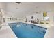 Indoor pool with a wet bar and fitness area at 7049 Myakka Valley Trl, Sarasota, FL 34241